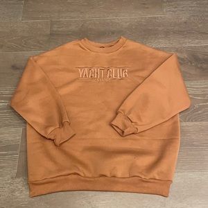 This is a brown, crew neck, from the store Shein.